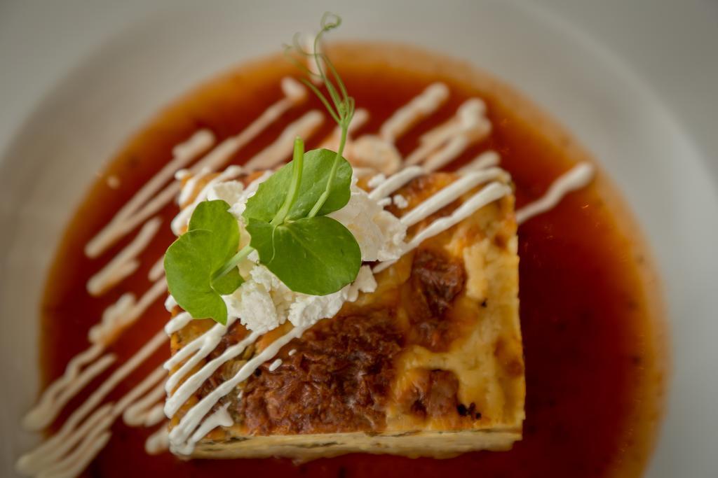 Suites Contempo เม็กซิโกซิตี้ ภายนอก รูปภาพ A piece of quiche with a garnish